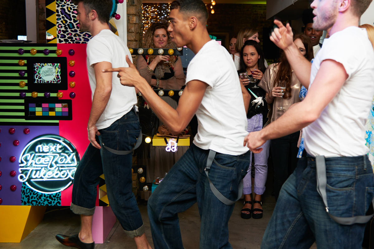 Party-goers interacting with the jukebox